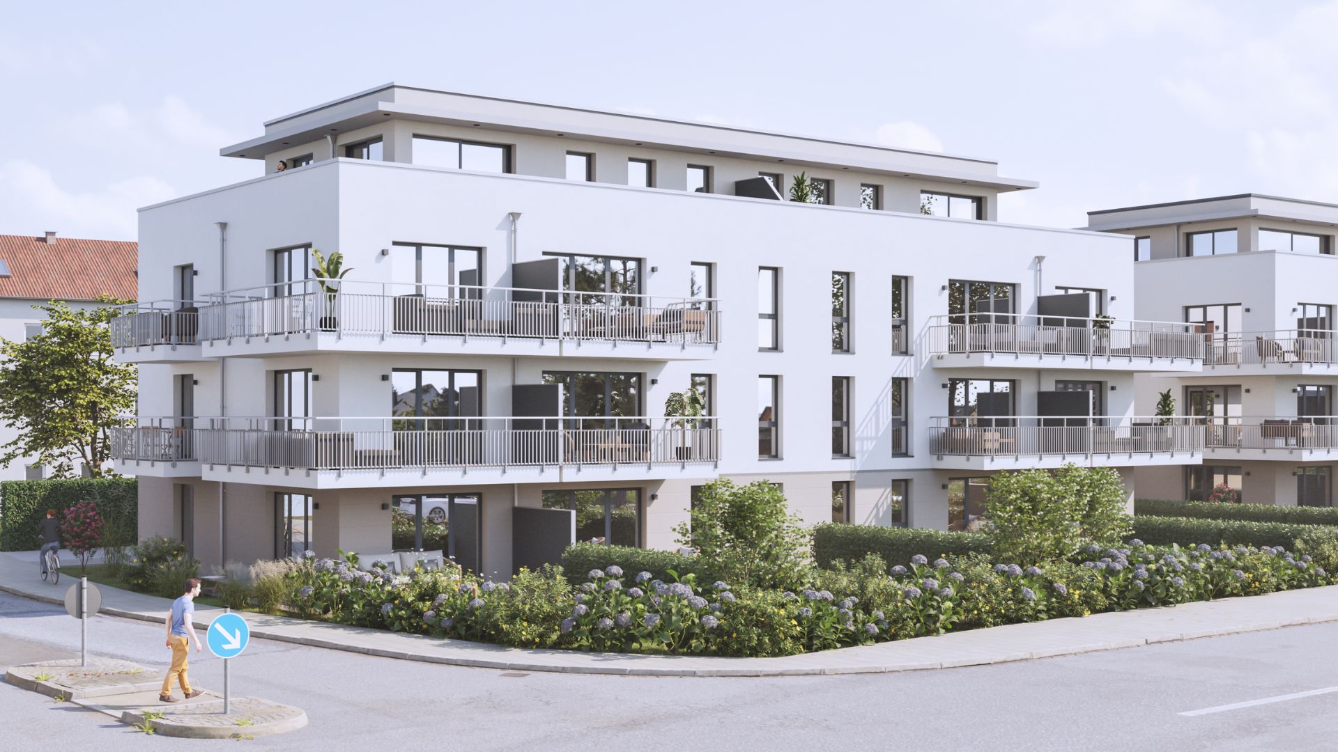 Moderne Wohnanlage mit weißen Fassaden, großen Fenstern, Balkonen und gepflegtem Garten.